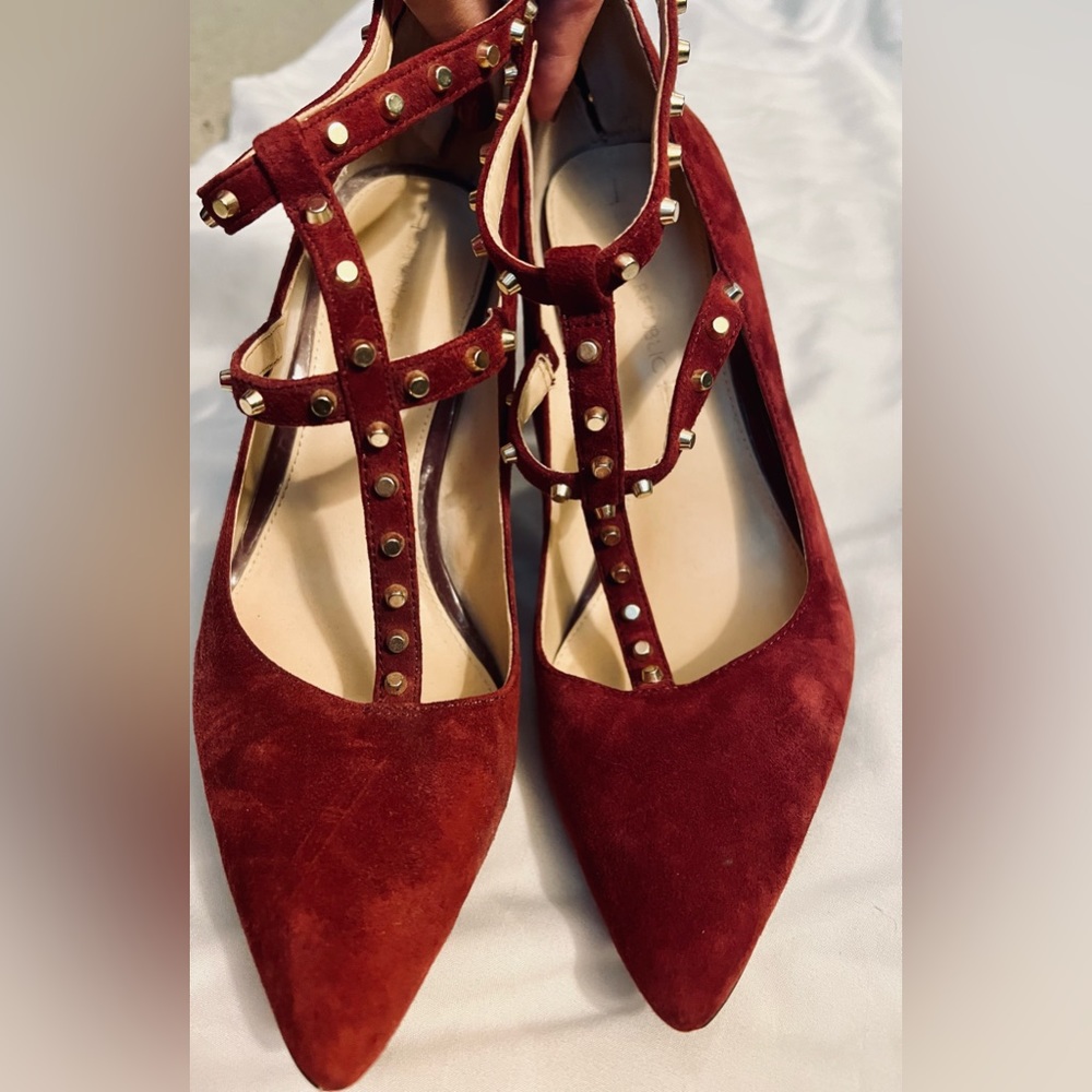 Merlot color gold stud straps heel.